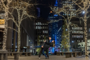 Engagement portrait in the city at Christmas.