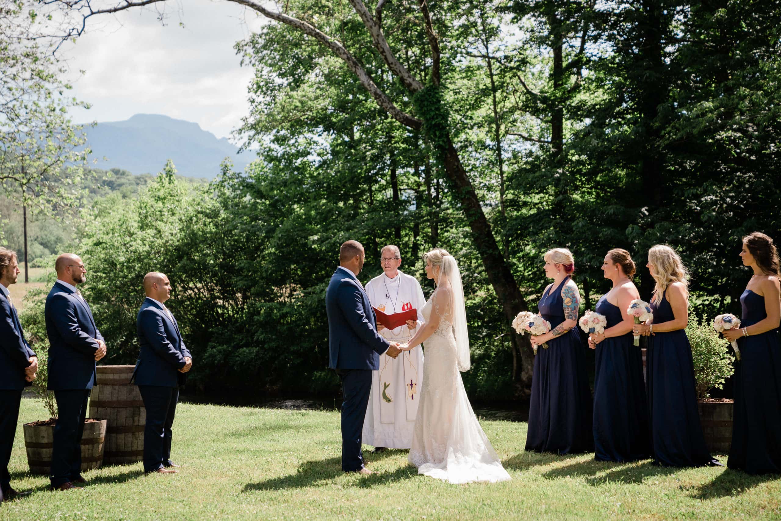 Wedding Ceremony on green grass with Granfather Mountain in the background