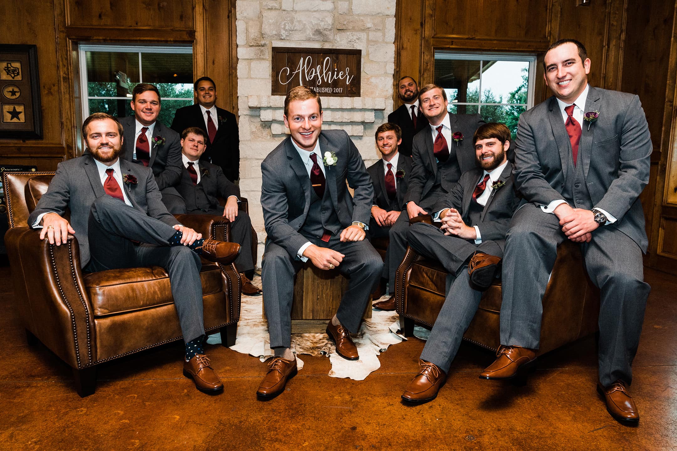 Groom and groomsmen pose for the camera